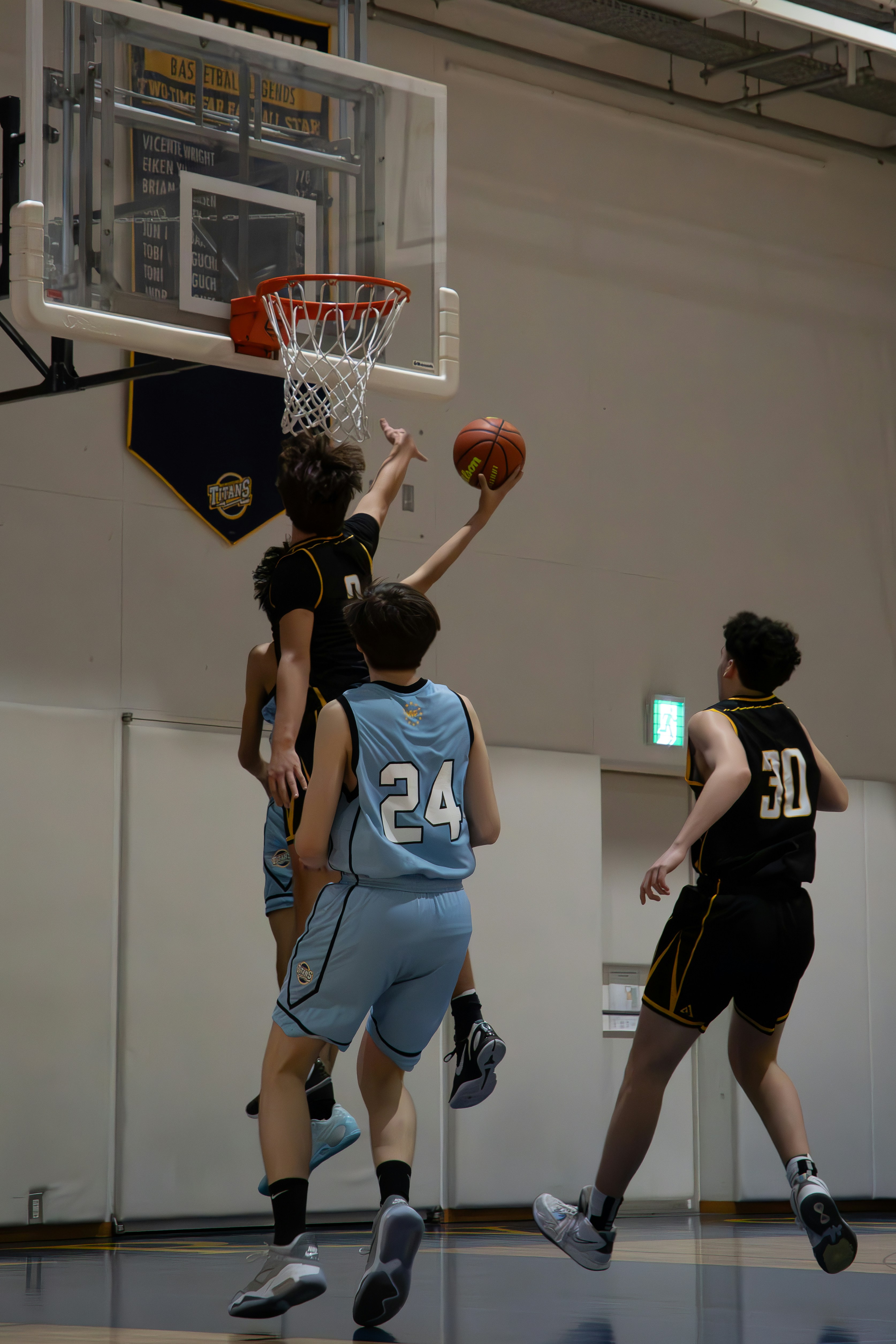 Players competing at the basketball rim